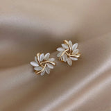 Elegant earrings in gold with exquisite floral patterns in opal