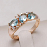 Golden ring with blue zircon