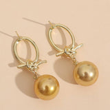 Brincos com pérolas douradas