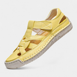 Ergonomic Kaia synthetic leather sandals cut at the side