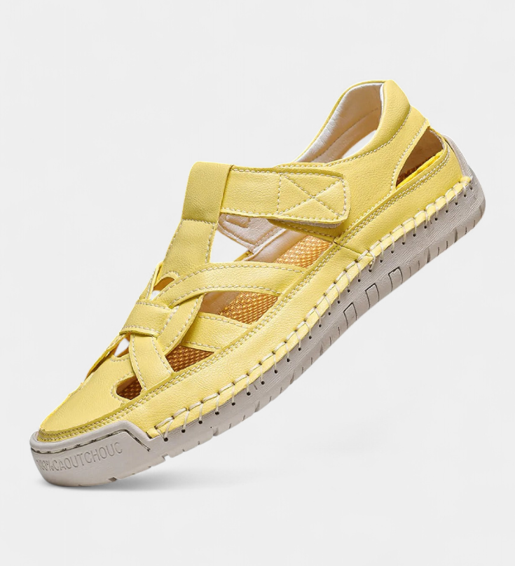 Ergonomic Kaia synthetic leather sandals cut at the side