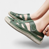 Ergonomic Kaia synthetic leather sandals cut at the side