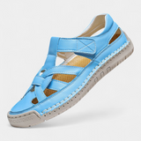 Ergonomic Kaia synthetic leather sandals cut at the side